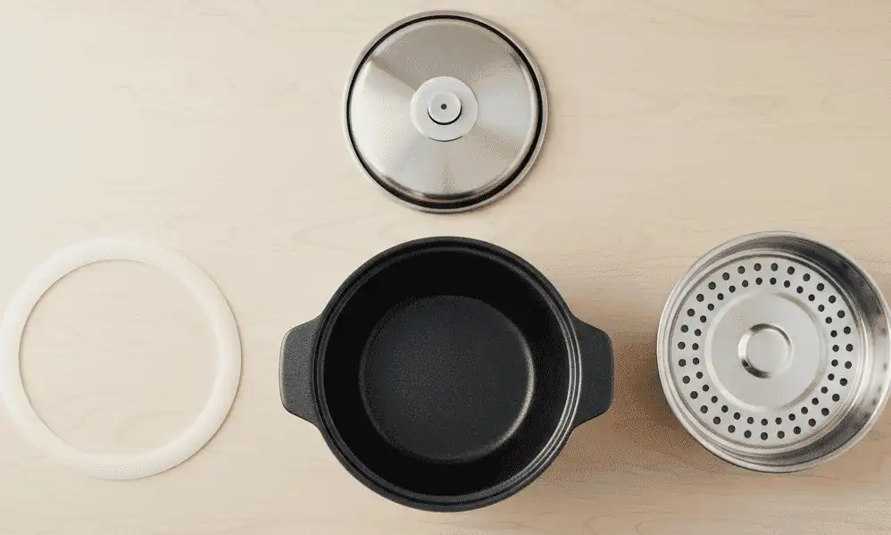 Exploded view of the removable inner lid, silicone seal, and ceramic pot ready for hand washing